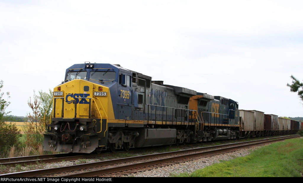 CSX 7395 leads a rock train